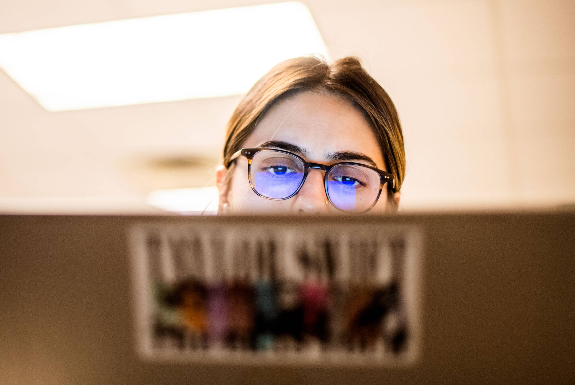 Natalie Aguirre works on her laptop during class. Aguirre’s professor, Alisha Karabinus, assistant professor of writing, uses AI tools in her writing and digital studies classes.